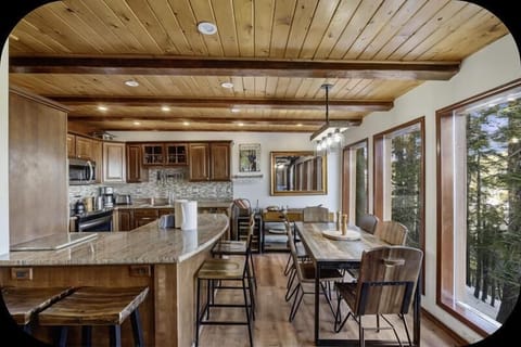 Kitchen and dining area with a wall of windows!