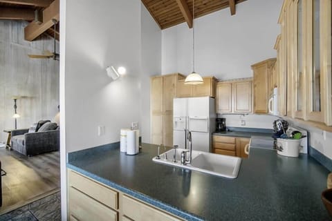 Forest green counter tops, high ceilings.
