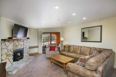 Comfy sectional sofa and TV, in front of the fire