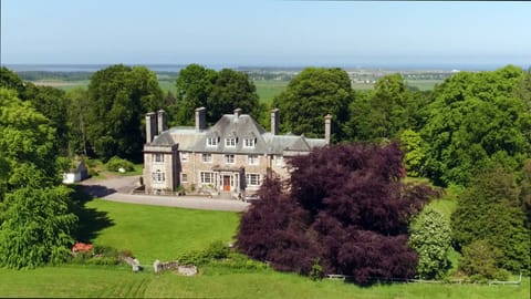 Burgie House from the front with Findhorn Bay & the stunning Moray Firth behind.