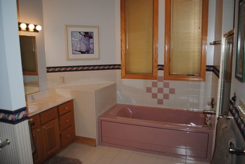 Jacuzzi Tub & walk in shower + large walk in closet off of bathroom.