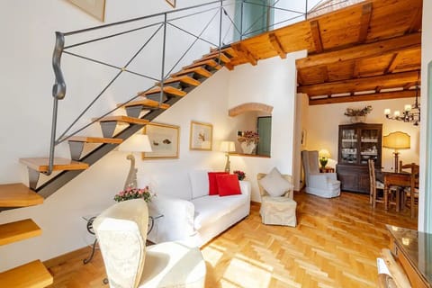 living area with the steps to the master bedroom