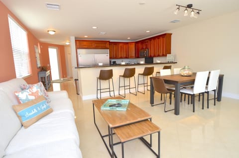 Spacious Open Living Area Features Leather Sectional Sofa + Dining + LED HD TV + Direct Pool Lounge Access...