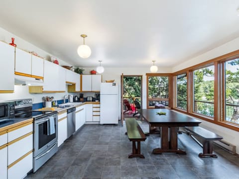 Open Kitchen area with bench seating around dining table