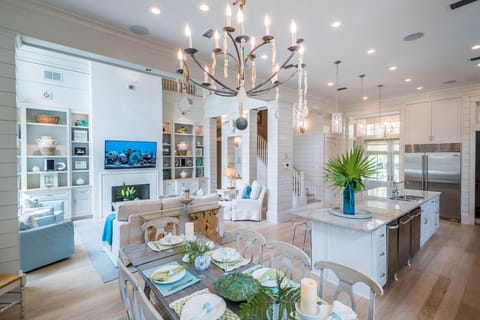 Expansive family room , ceilings that soar to 22 feet, 65 inch 4K TV & fireplace