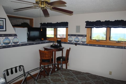 The Crow's Nest has a table, two chairs, and a KING SIZE BED to relax and enjoy!