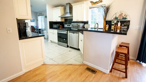 Kitchen with black galaxy granite counter tops and extra large double sink.