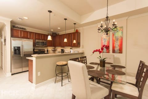 The dining room and kitchen. Dining room table seats 6; breakfast bar seats 2.