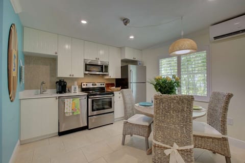 New kitchen with stainless appliances and dining for 4 people.