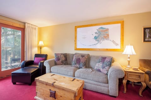 Unwind in this inviting living room with comfortable seating, warm lighting, and Alaskan charm that makes you feel right at home.