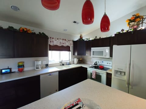 Bright open kitchen with all amenities you need for cooking