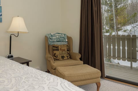 Curl up in your cozy reading nook with winter views, soft lighting, and comfortable seating for ultimate relaxation.