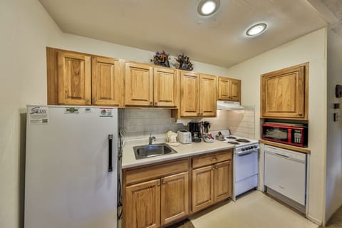 Your fully equipped kitchen awaits with warm wood cabinets, stainless steel appliances, and everything you need to prepare delicious meals during your stay.