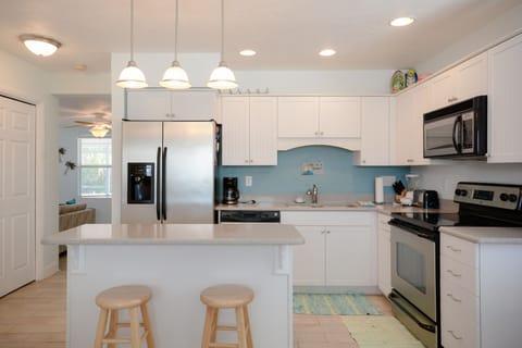 Fully Equipped Kitchen with Granite Counter Tops and Stainless Steel Appliances