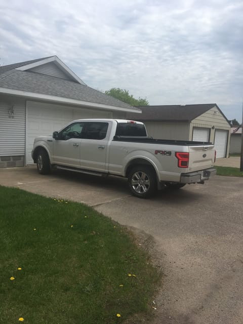 You can fit 2 full size trucks in the driveway (next to each other).