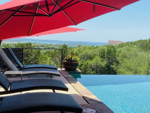 Comfy shaded lounge chairs by the pool w/ a great view! 