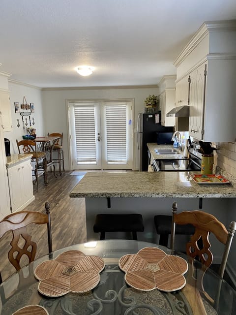 Front entrance through kitchen