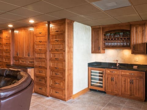 Relax and unwind in the open family room downstairs with 60 inch TV