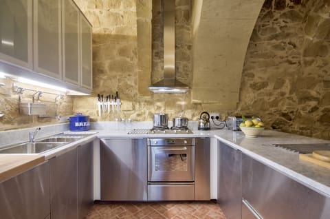 Another angle of the kitchen showing the ample storage and work surfaces