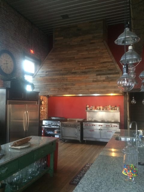 Commercial stove and flat top in kitchen
