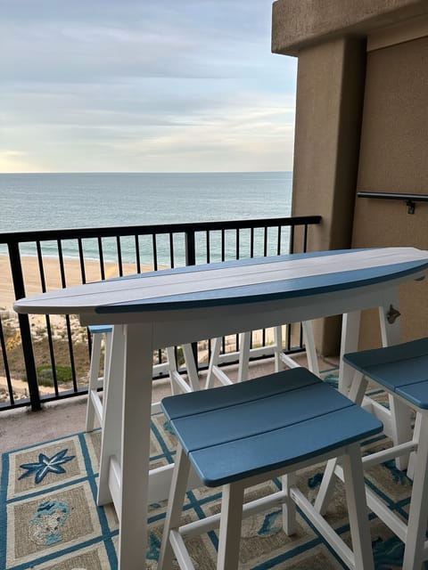 Enjoy a cocktail or lunch overlooking the pool and the ocean from the balcony.