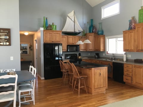 Well equipped kitchen to serve all your cooking needs along with a lake view!