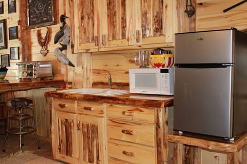 Kitchen cabinets filled w/cups, plates and silverware and a new convection oven!