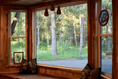 While enjoying the comforts of the cabin you have a beautiful view of the forest
