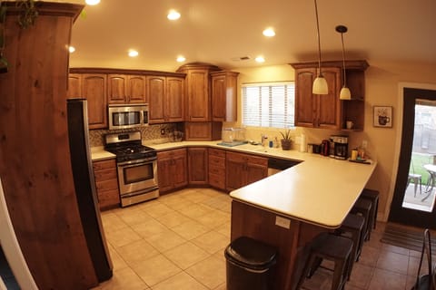 Fully stocked kitchen and breakfast bar, seats 4. 