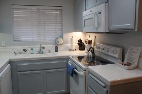 Kitchen window looks out over garden courtyard/fountain