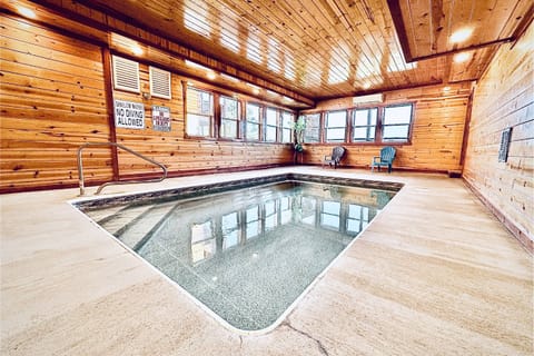 Take a dip in the Heated indoor private pool! 5-6 feet deep on the far end! Find it at The Blissful Bear Lodge!