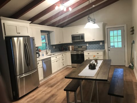 Fabulous kitchen with SS appliances and large farm table for family meals. 