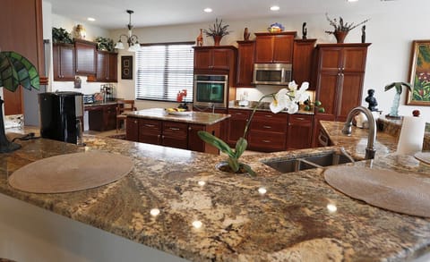Large spacious kitchen with built in oven and microwave and center island
