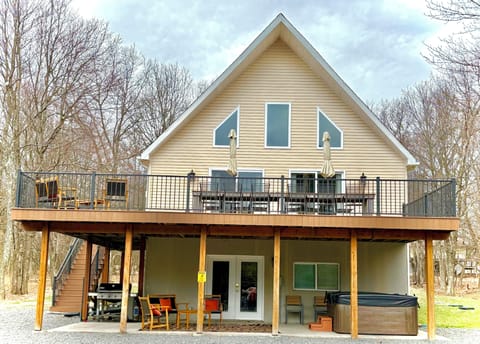 Patio with weber grill, hot tub second floor deck with patio table