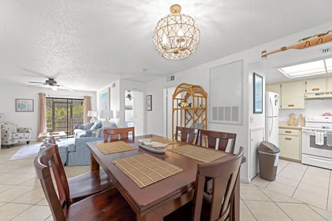The dining room space is in between the kitchen and the living area.