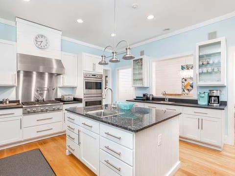 Professional grade appliances and Granite countertops and three sinks!