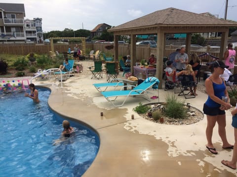 Friends gather, grill, swim, sunbathe,  hammock, salt water pool, hot tub