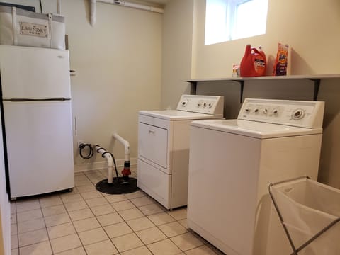 laundry room with a second fridge