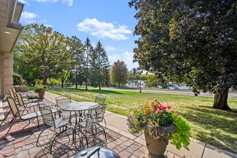 Lake view patio with a charcoal grill