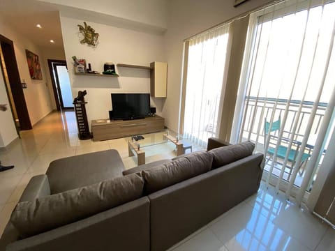 Living room full of light adjacent to the balcony