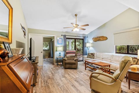 Spacious living room area with access to the porch.