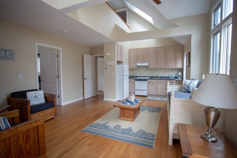 The second living room is complete with kitchen, tv and is set up to relax in wh