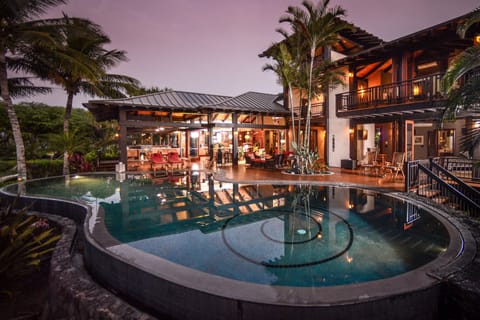 Evening shot of infinity pool with large decks