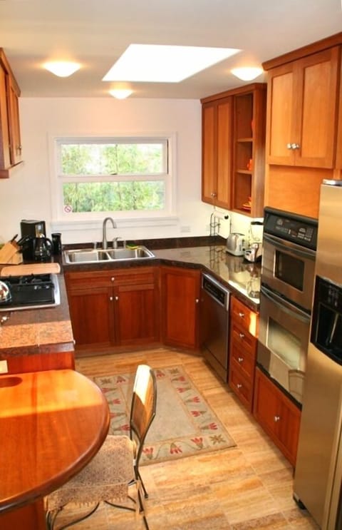 View of kitchen from fireplace hearth.