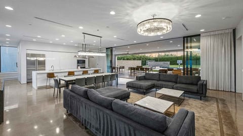 Spacious open-concept living area with indoor-outdoor flow.