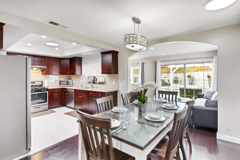 Kitchen, dining and family area with nice view of large back yard