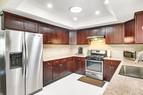 Large kitchen area with newer appliances and furnishings
