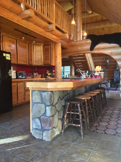 Kitchen . 18 ' long stone island, a wonderful gathering and prep area.