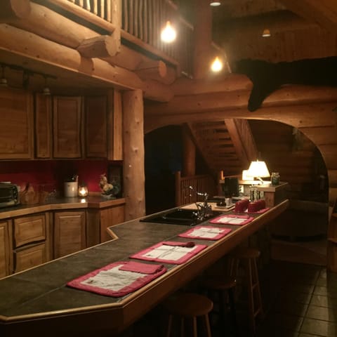 Kitchen with 18’ island Perfect for gathering and meal prep Weber grill . 