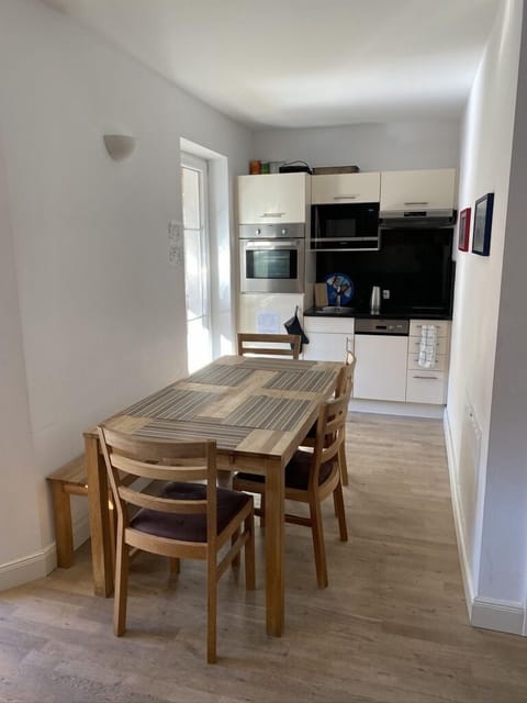 Dining area & kitchen: oven, microwave, 2-ring hob, dishwasher, fridge-freezer